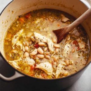A bowl of freshly shredded chicken, ready to be added to a recipe, with a clean and tender texture.